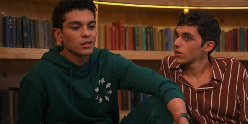 Florian and Q talk while sitting on the library floor in XO, Kitty.