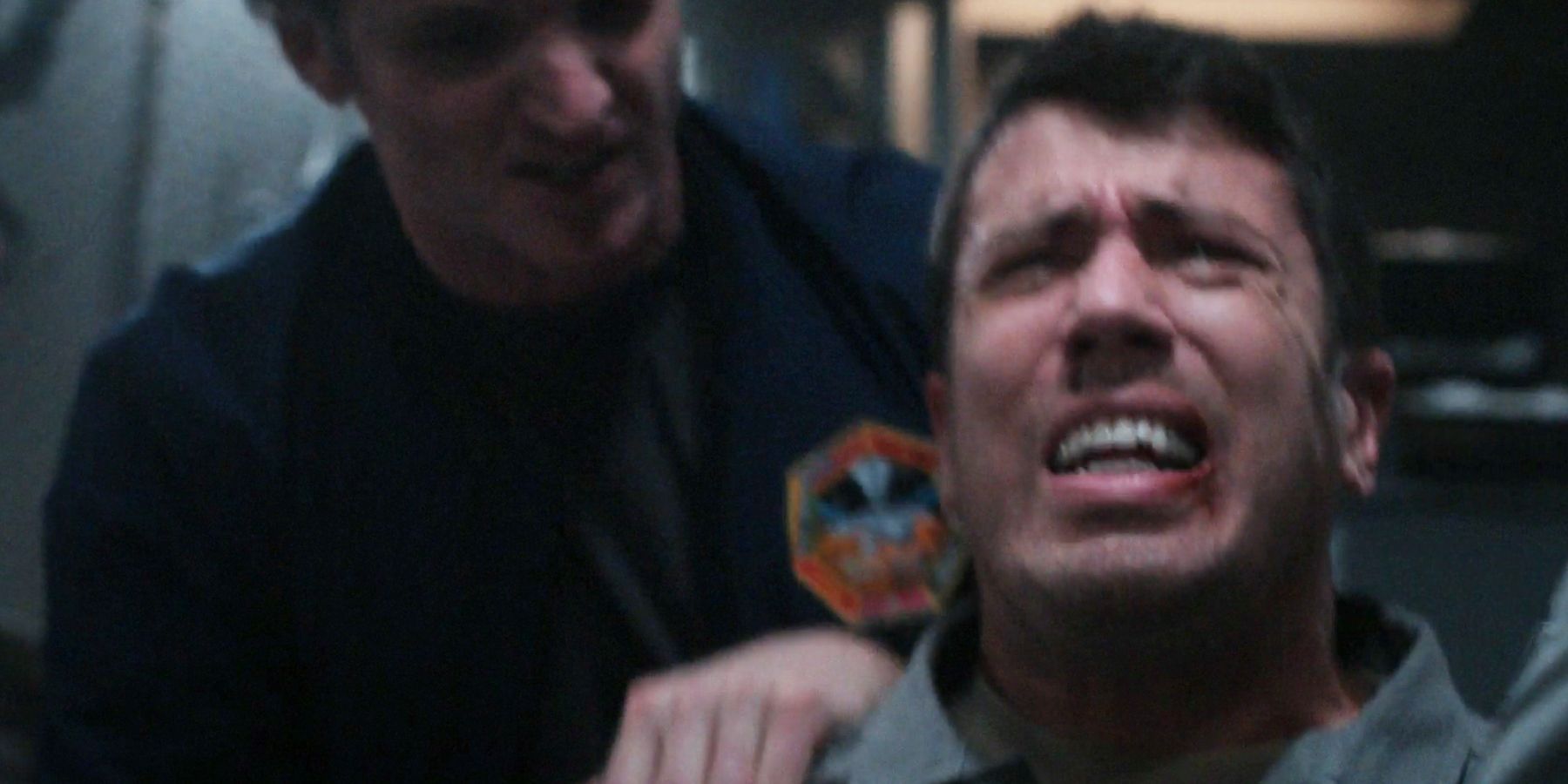 Miles is forcefully held down in a chair and beaten