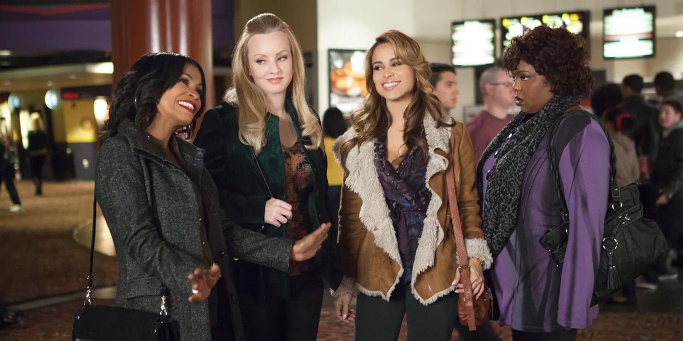 four of the five ladies from The Single Moms Club standing together in a movie theater