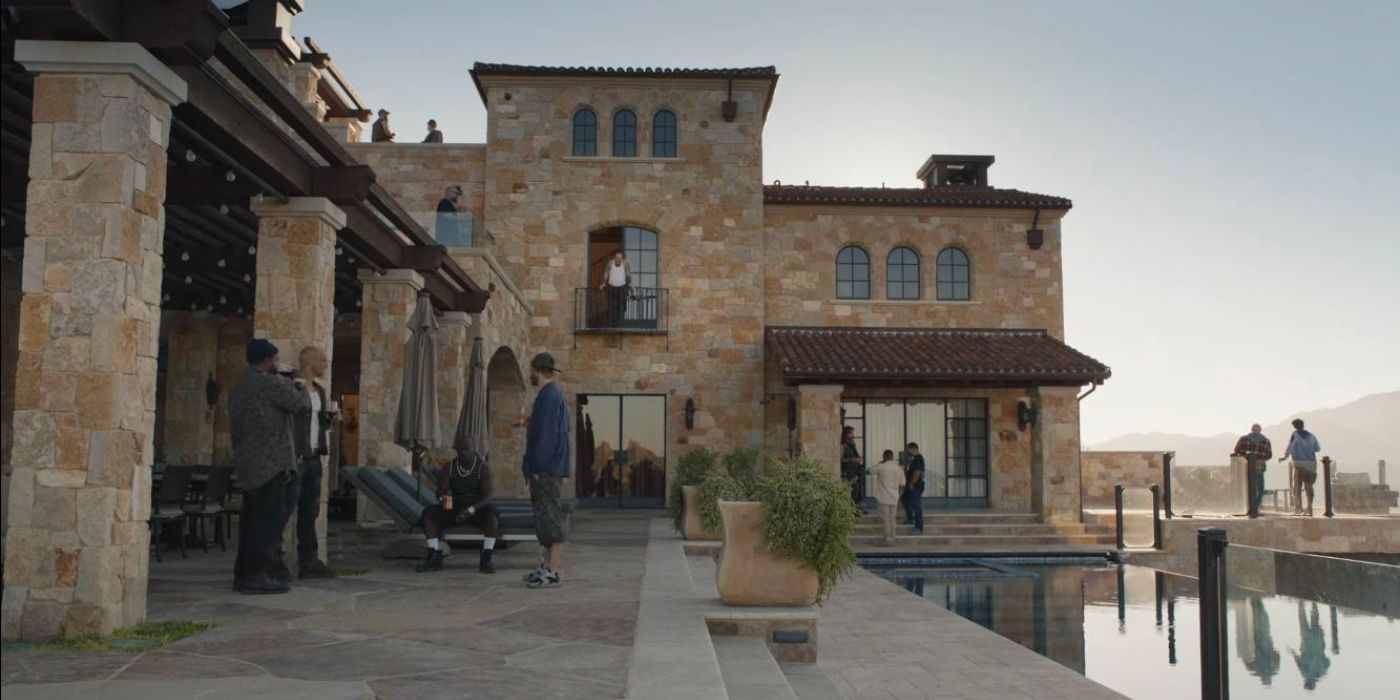 Fuches' gang outside their mansion hanging out in Barry season 4 episode 7 a nice meal.