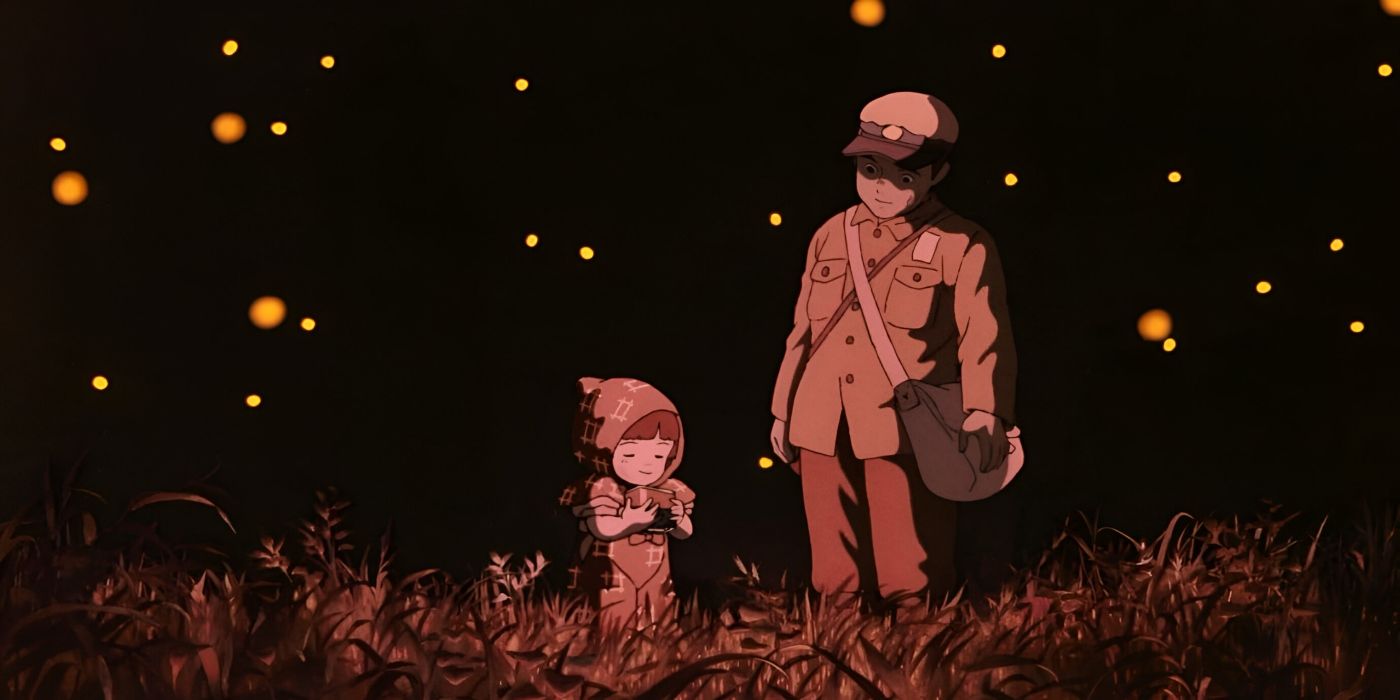 Seita and Setsuko stand in a field at night with fireflies from Grave of the Fireflies.