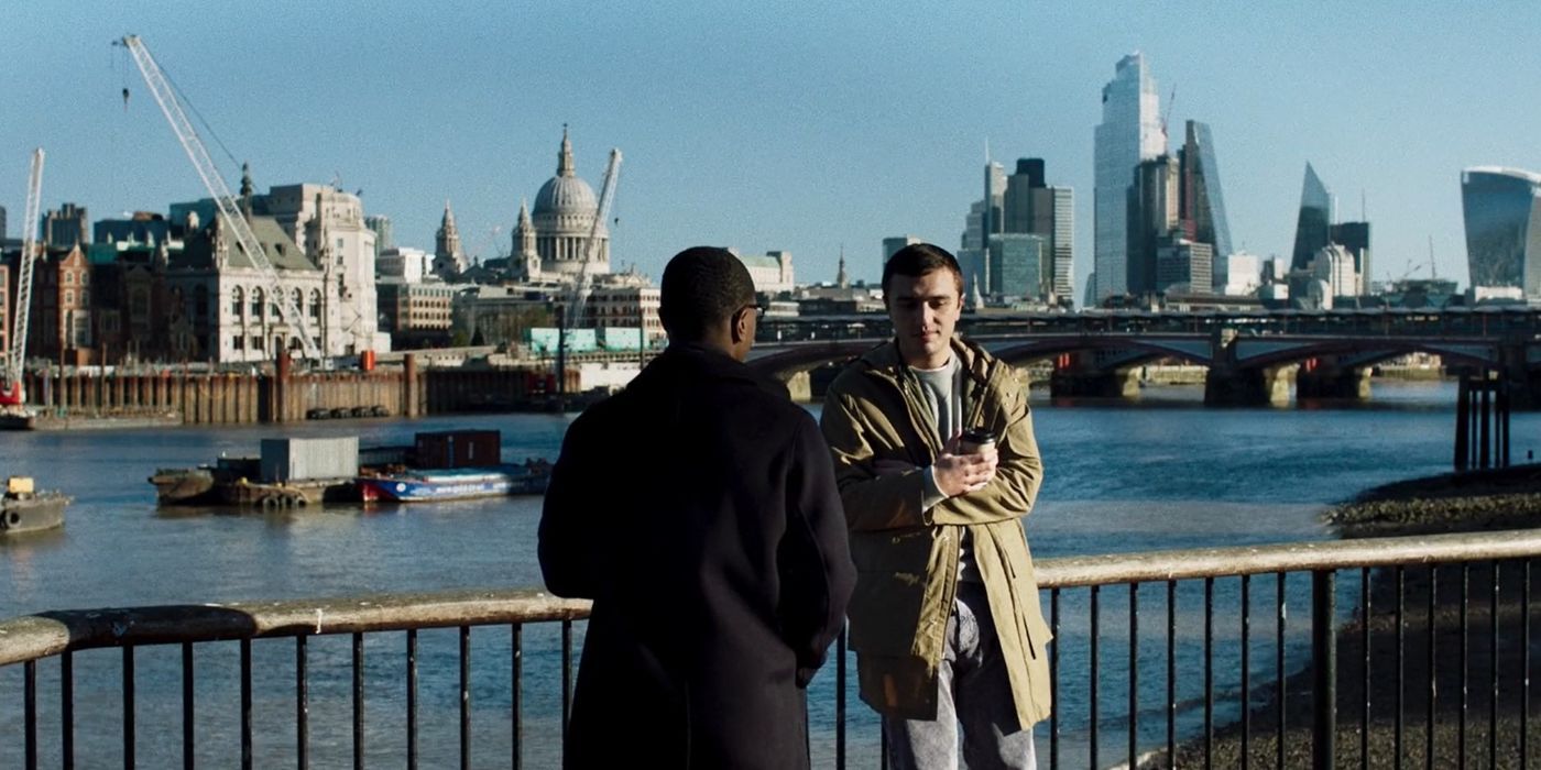 Gus (David Jonsson) and Leo (Sonny Poon Tip) talking together next to a river in Industry season 2 episode 7.