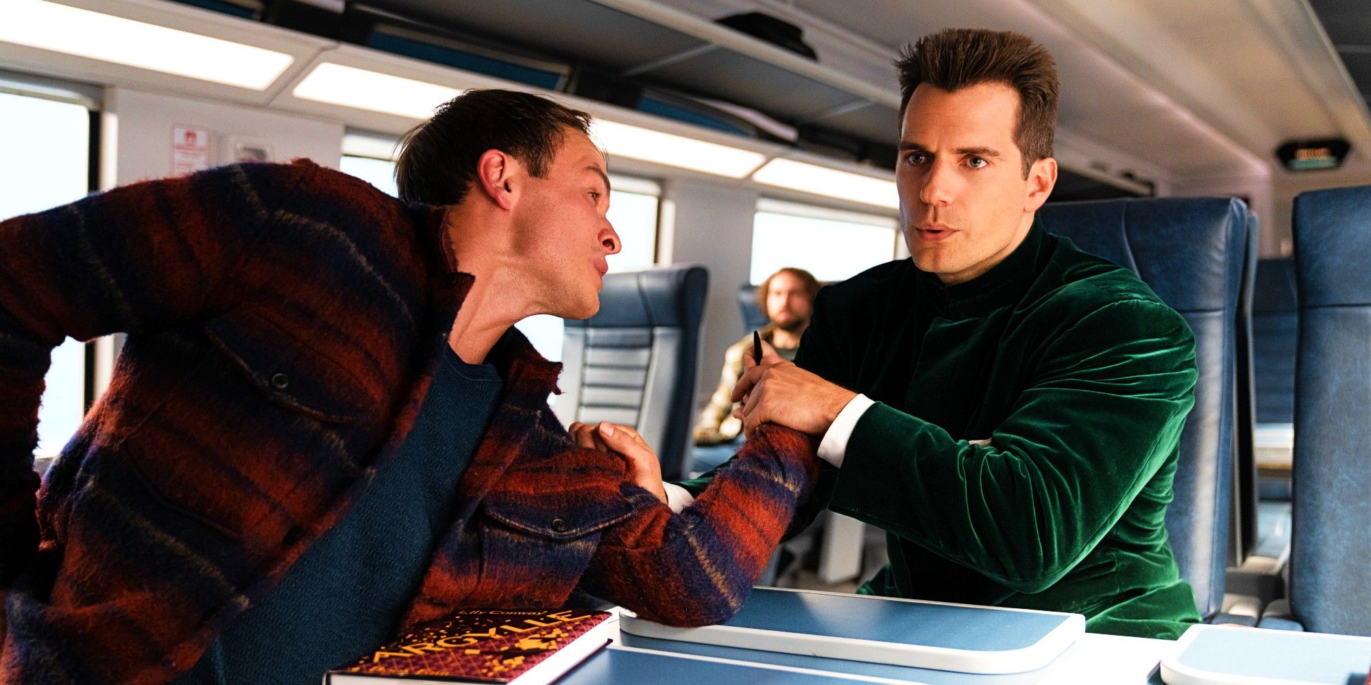 Henry Cavill As Agent Argylle Breaking A Man's Wrist On A Train In Argylle