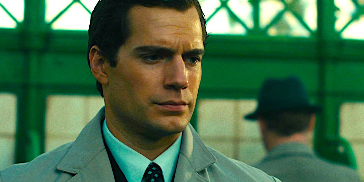 Henry Cavill looking down with a slightly bemused expression in The Man from UNCLE