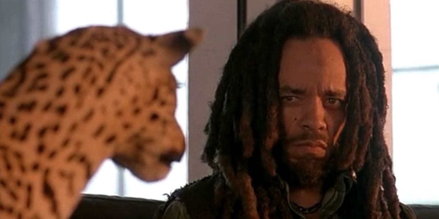 Ice-T as Jack Mason glares at a taxidermy cheetah in Surviving the Game.