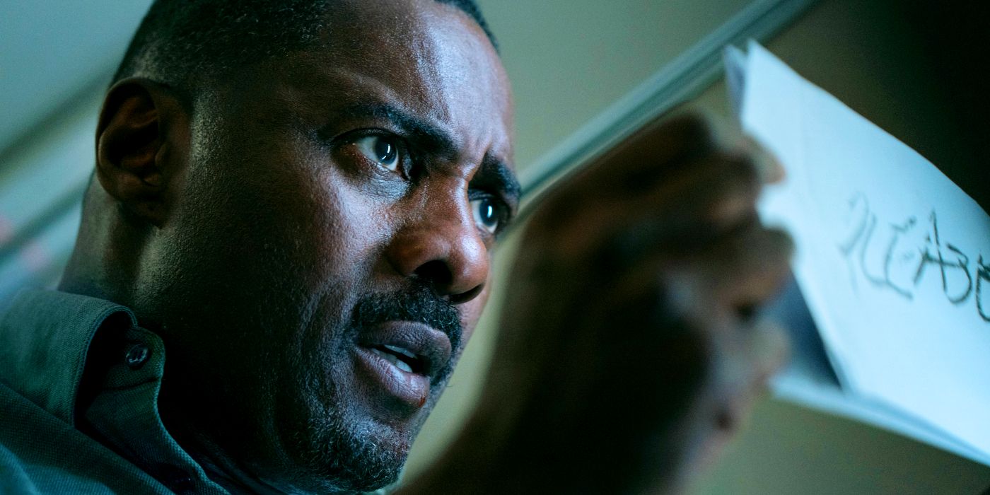 Idris Elba as Sam Nelson Looking at a Piece of Paper in Hijack Season 1