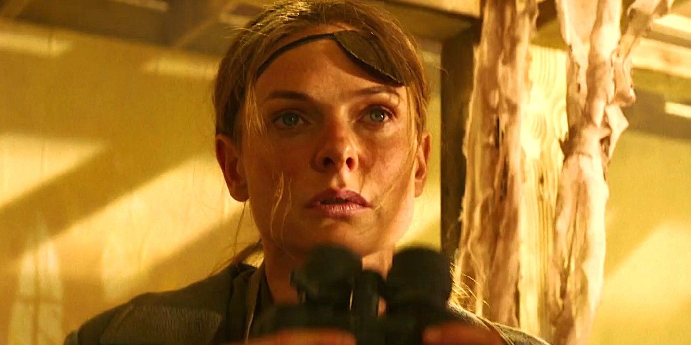 Ilsa Faust (Rebecca Ferguson) with binoculars in Mission Impossible Dead Reckoning