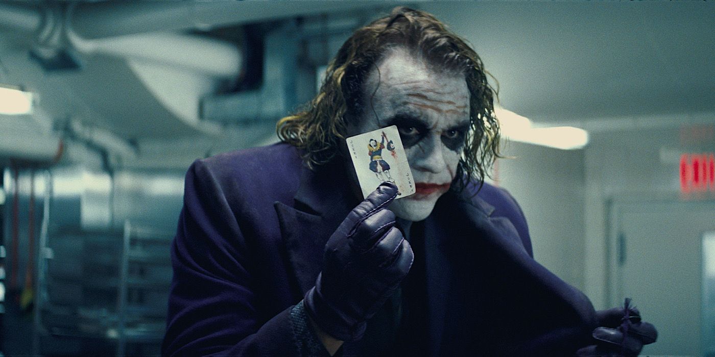 The Joker is holding up a playing card in The Dark Knight.