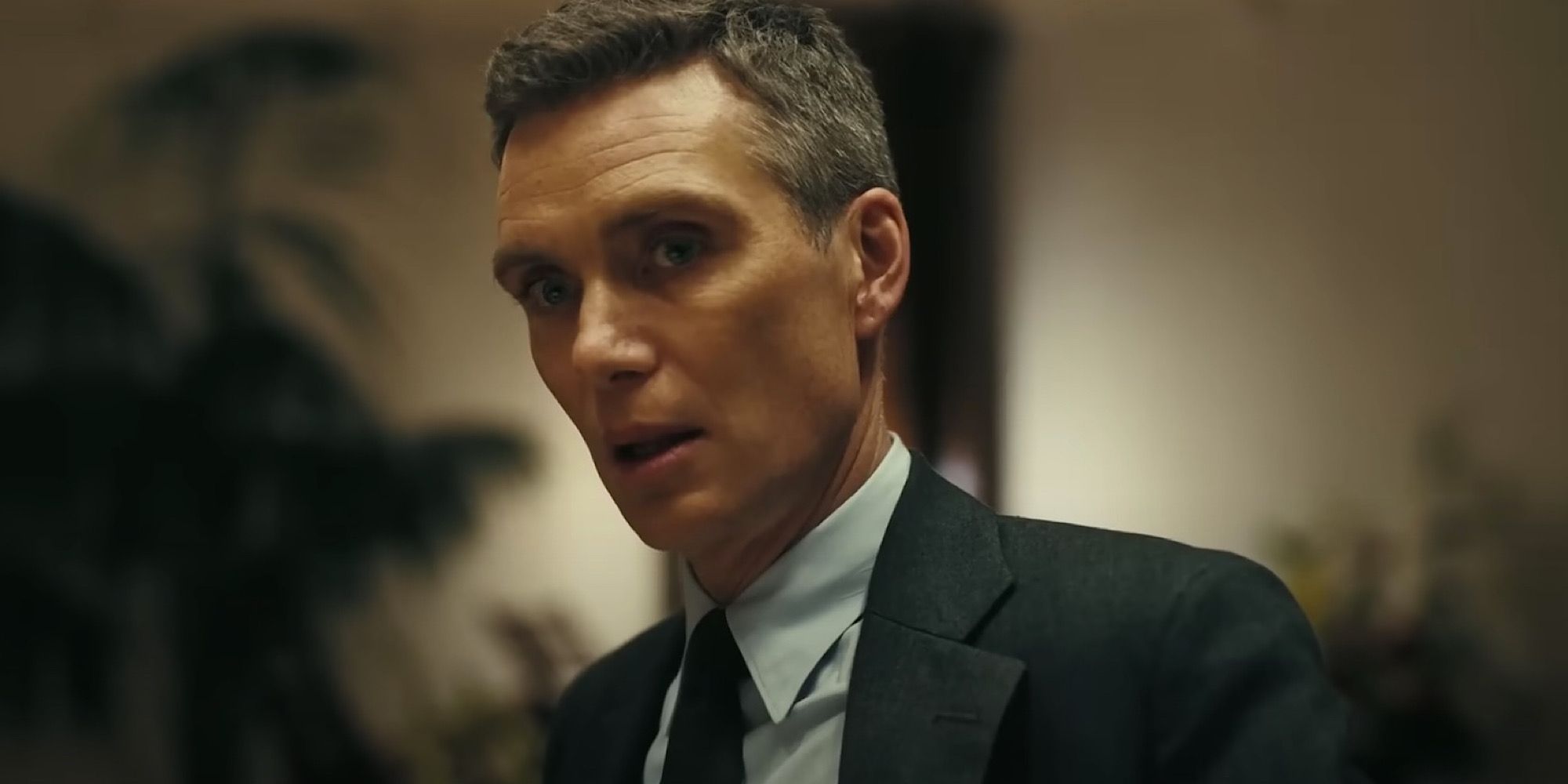 Oppenheimer (Cillian Murphy) Opening his mouth in Oppenheimer.