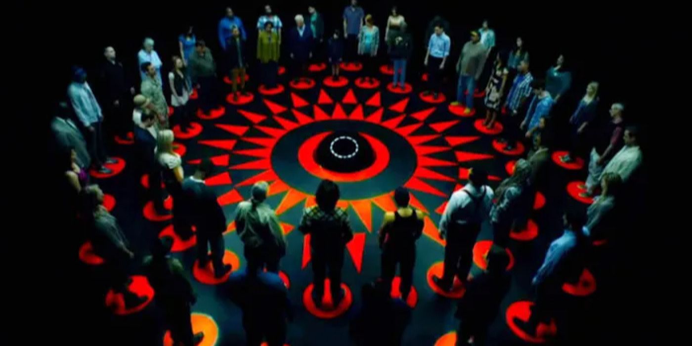 50 people stand in a circle on red dots in Circle.