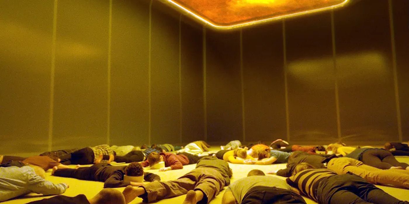 The travelers lay on the floor in a yellow room in Aniara. 