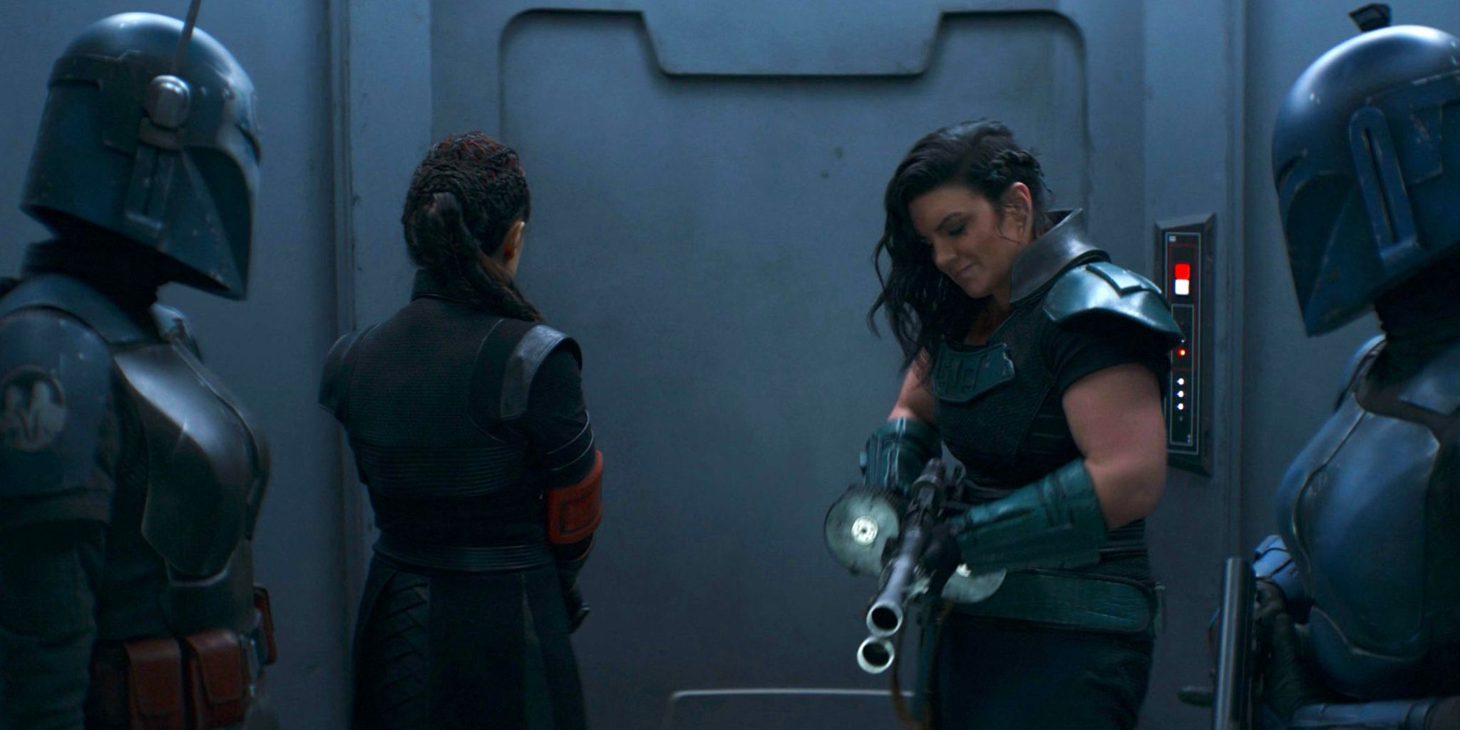 Cara Dune tries to unjam her gun in an elevator with Bo-Katan Kryze, Fennec Shand, and Koska Reeves in The Mandalorian season 2 finale