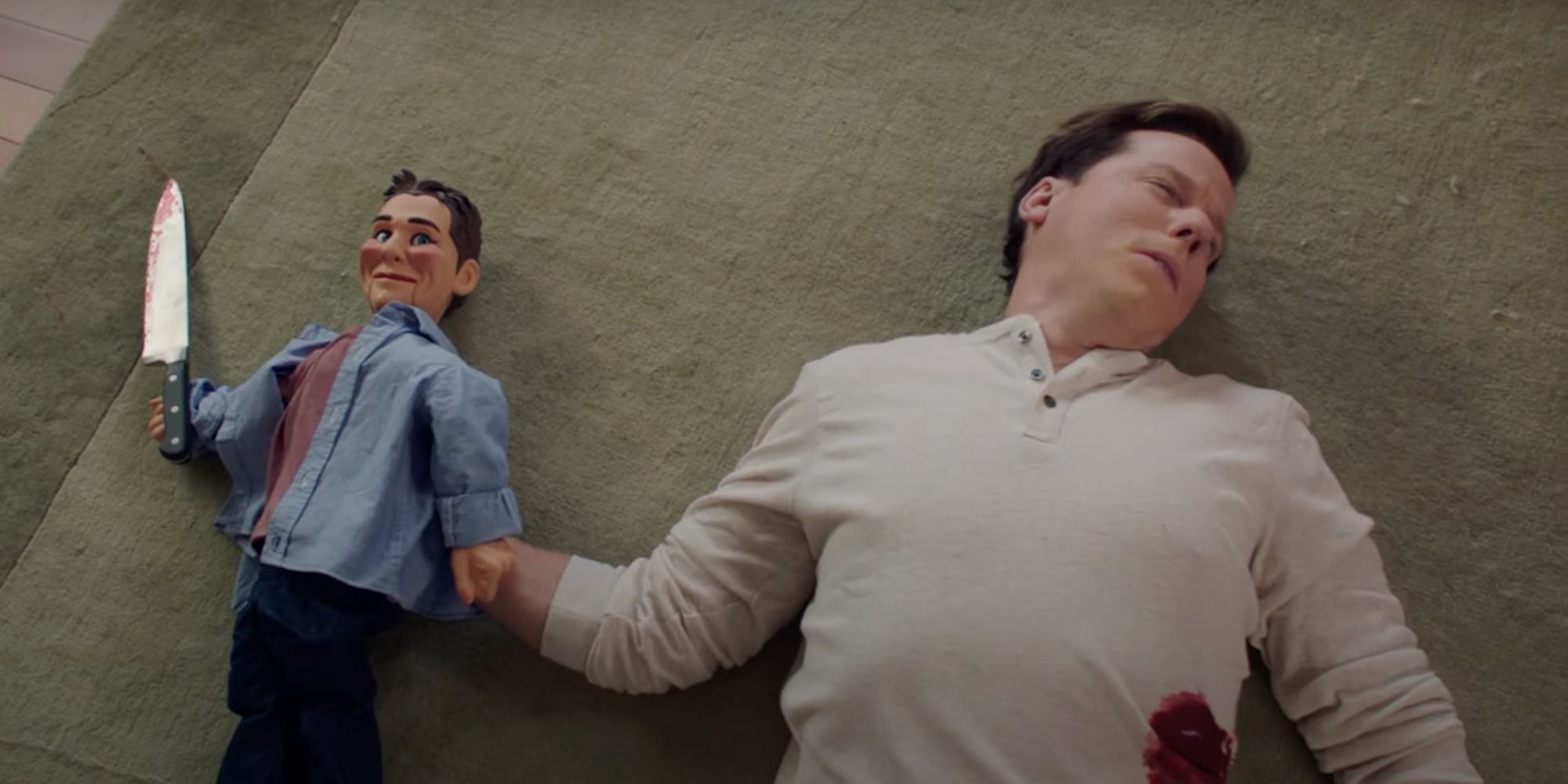 Jeff Dunham lying on the ground with a dummy in Tacoma FD