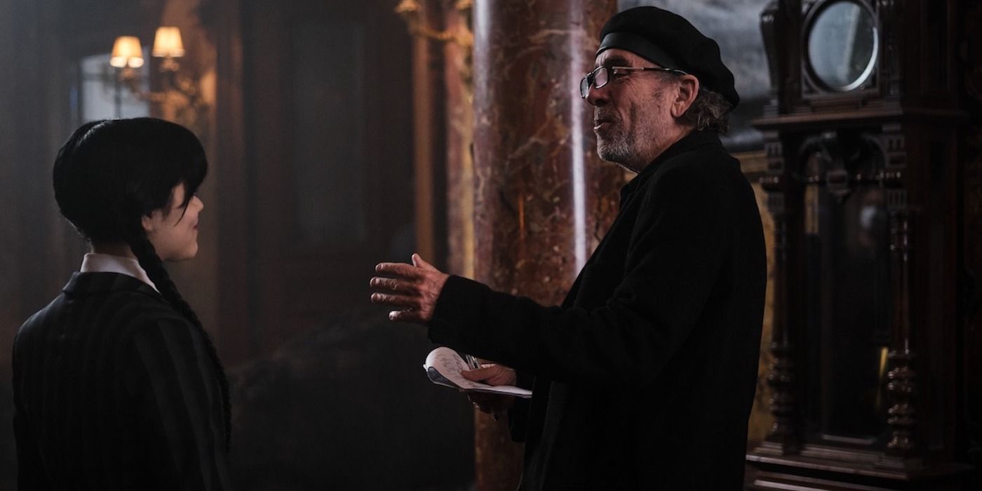 Tim Burton talking to Jenna Ortega on the set of Wednesday.
