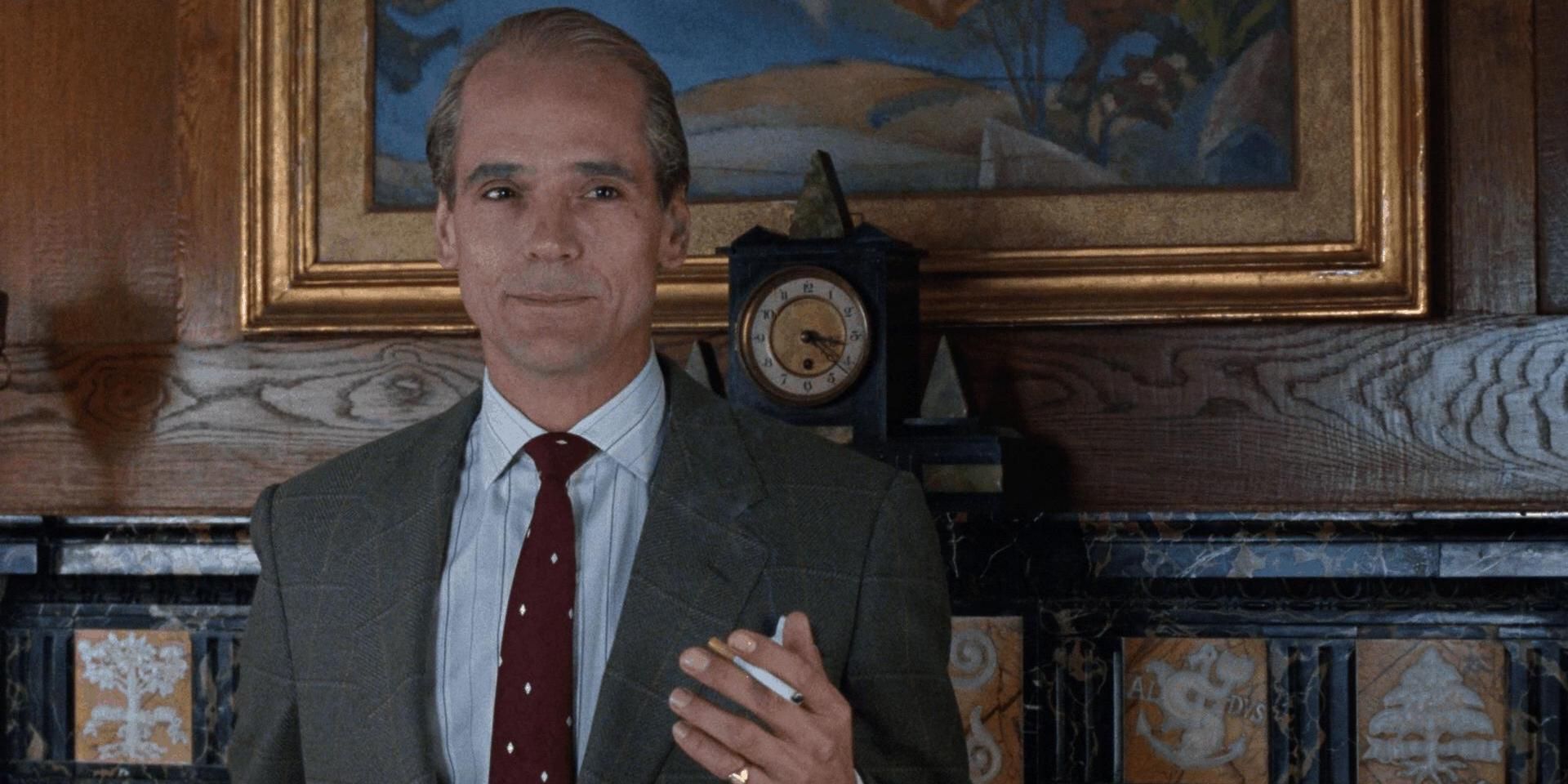 Jeremy Irons holding a cigarette in Reversal of Fortune.