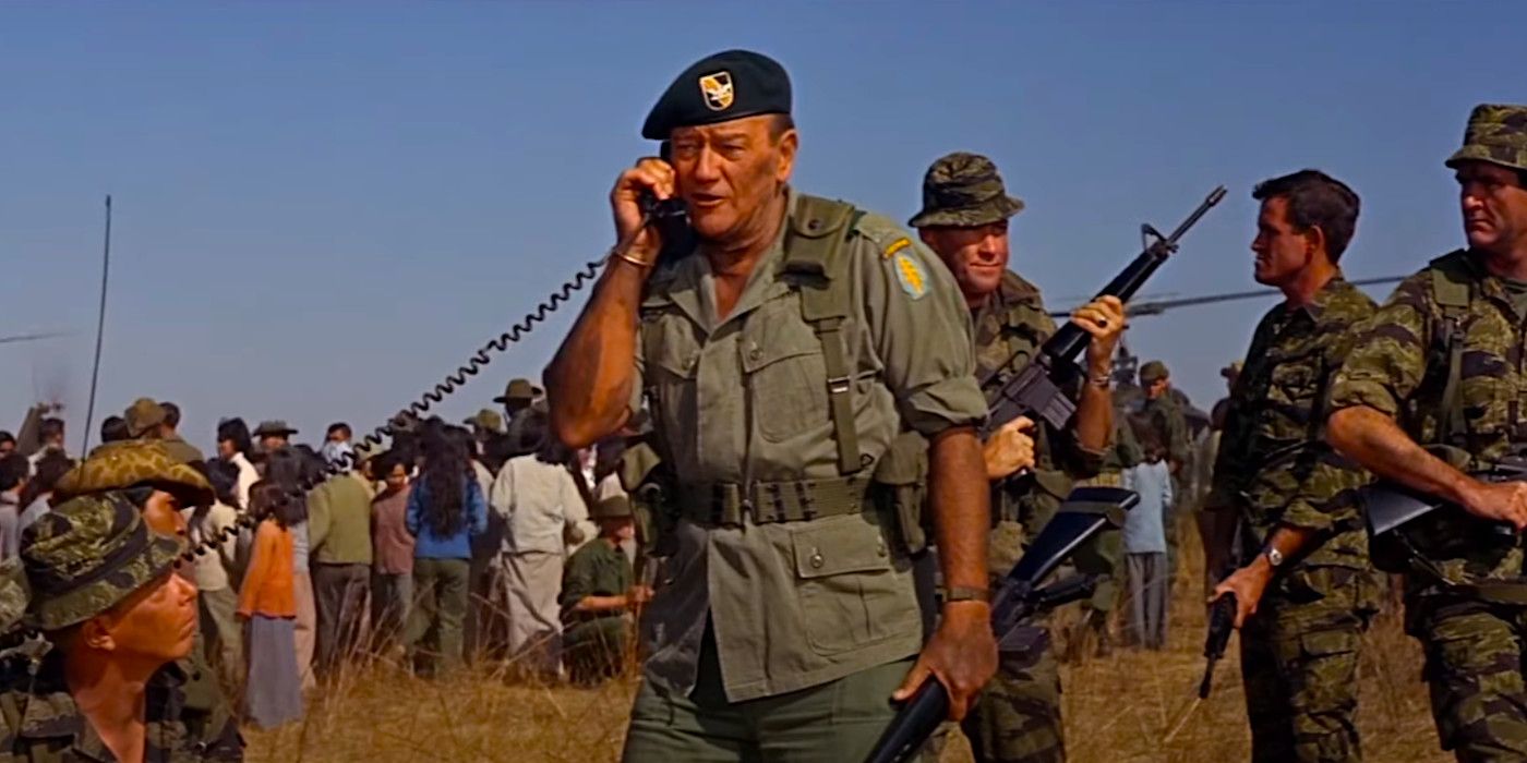 John Wayne in military gear calling in an air strike in a dramatic scene from The Green Berets
