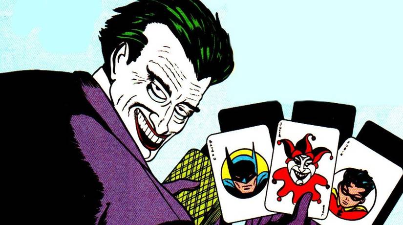 Comic book art: the joker's first appearance in dc comics holding playing cards with Batman and Robin's faces
