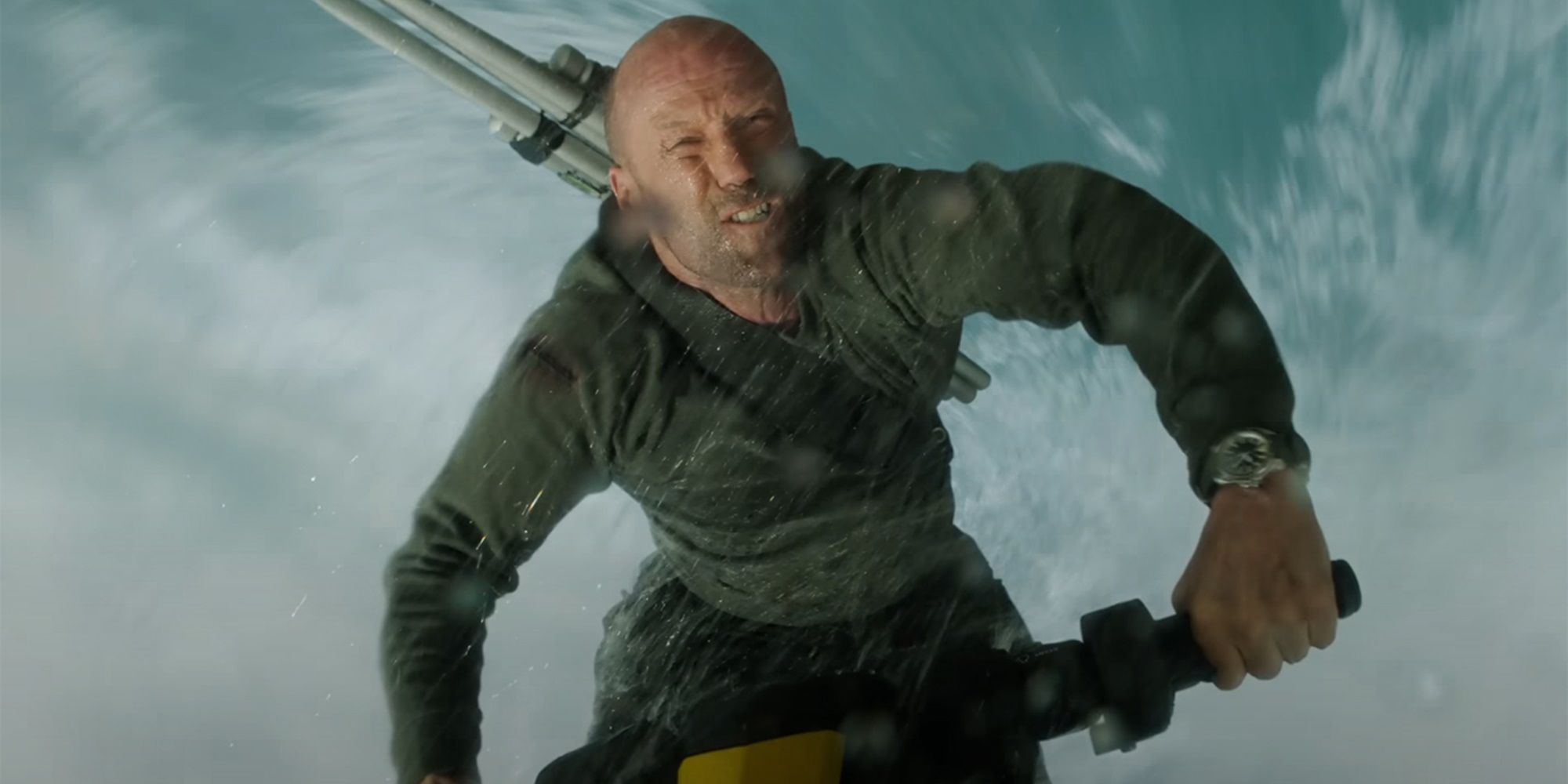 Jason Statham as Jonas Taylor riding a jet ski in The Meg 2: The Trench