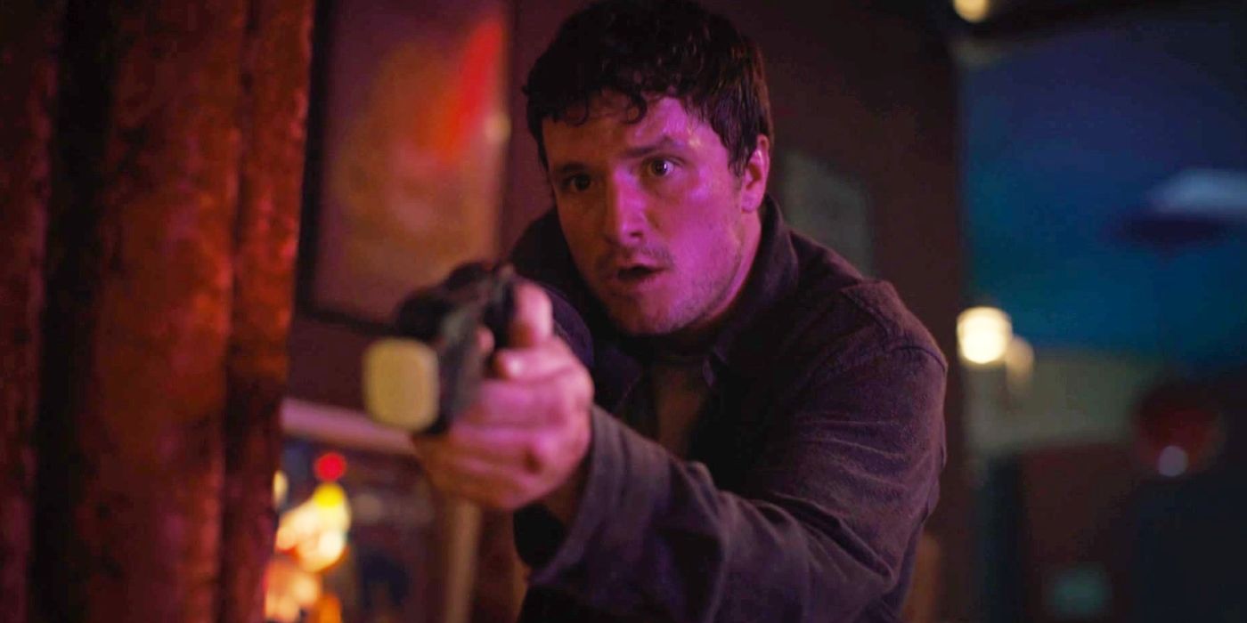 Josh Hutcherson as Mike holding a taser gun in Five Nights at Freddy's