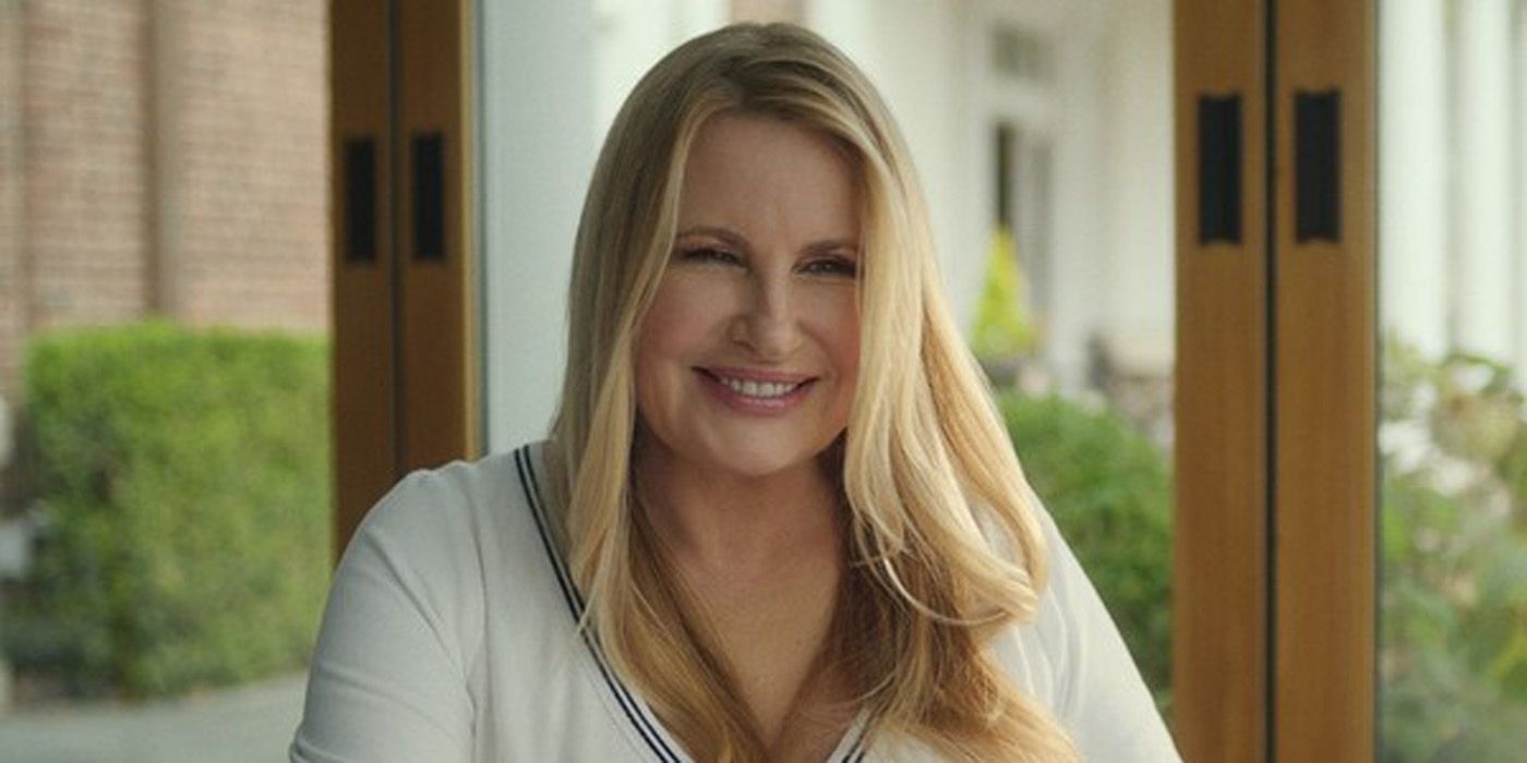 Jennifer Coolidge as Karen smiling in the Watcher