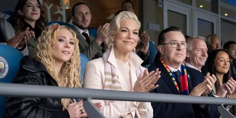 Keeley Jones (Juno Temple) and Rebecca Welton (Hannah Waddingham) clapping in the stands in Ted Lasso season 3 episode 11.