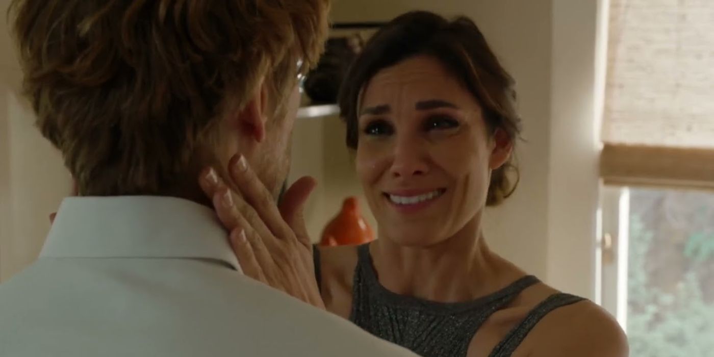 Kensi (Daniela Ruah) crying and telling Deeks (Eric Christian Olsen) she's having a baby in NCIS LA season 14 episode 21.