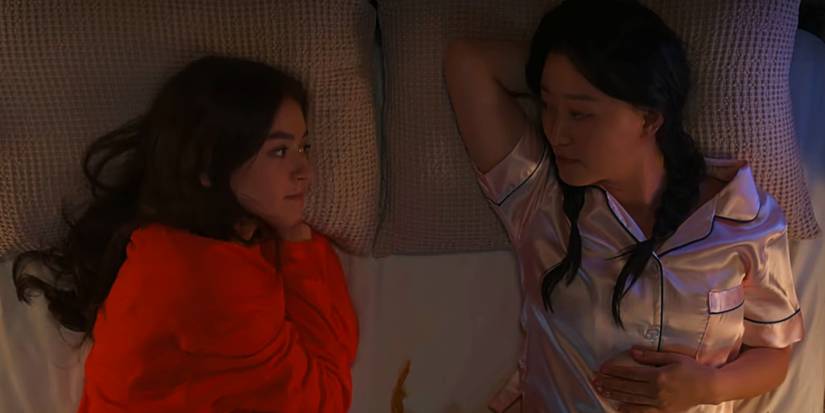 Kitty and Yuri lay in bed looking at each other XO, Kitty