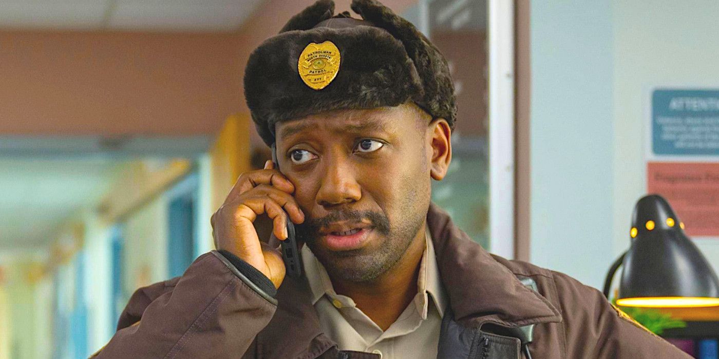 Lamorne Morris as Witt talking on the telephone with a concerned expression in a scene from Fargo season 5