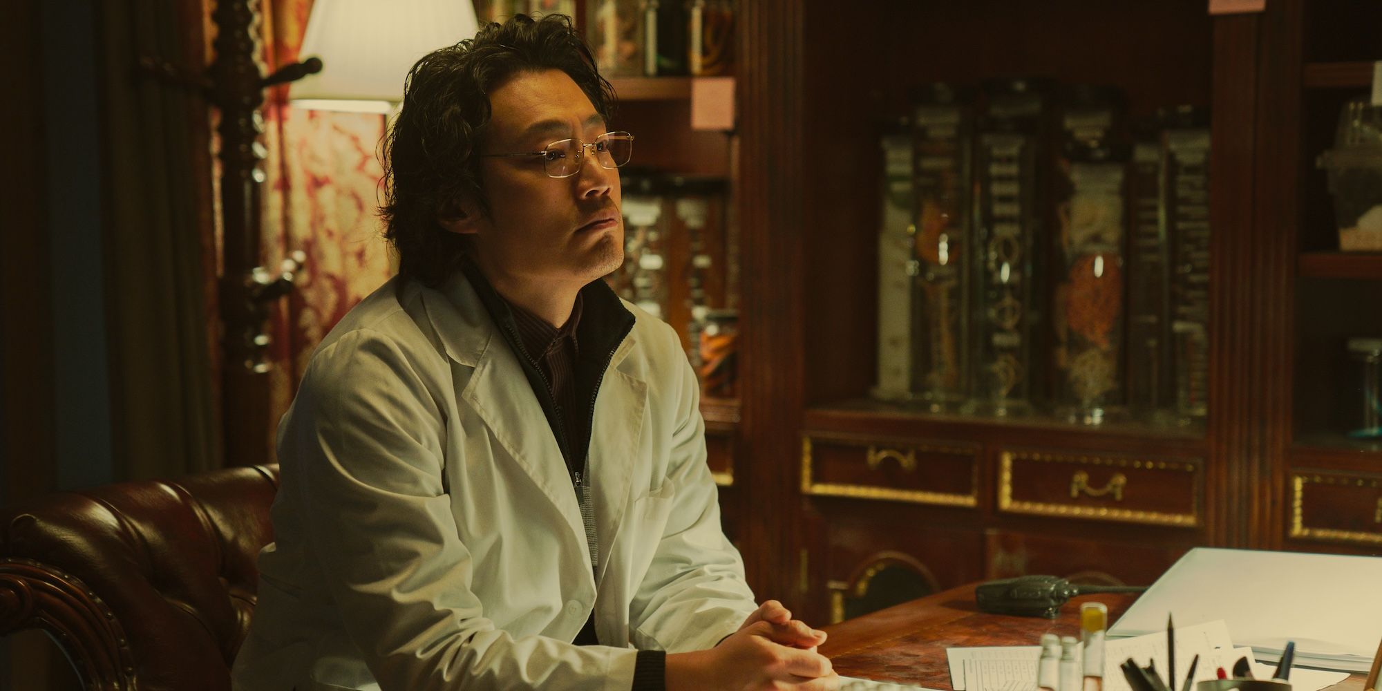Lee Hee-jun sits at his desk in Badland Hunters