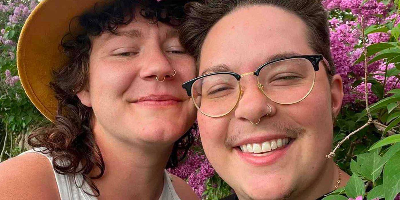 Leon brown and audrey kriss Sister Wives posing happily in front of a hedge