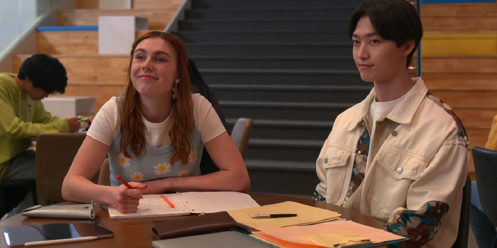 Madison and Min Ho sit at a table in detention in XO, Kitty.