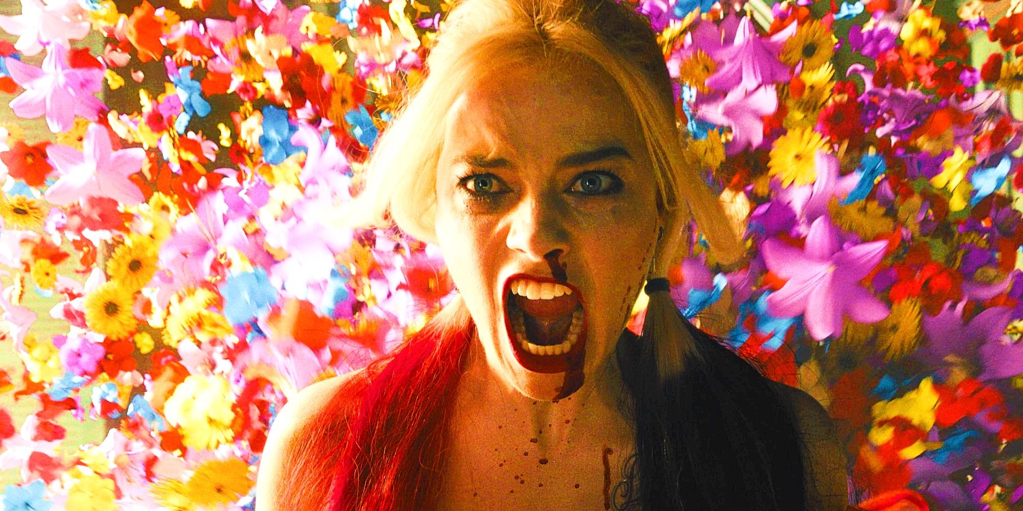 Margot Robbie As Harley Quinn Screaming In Front Of Exploding Flowers In The Suicide Squad