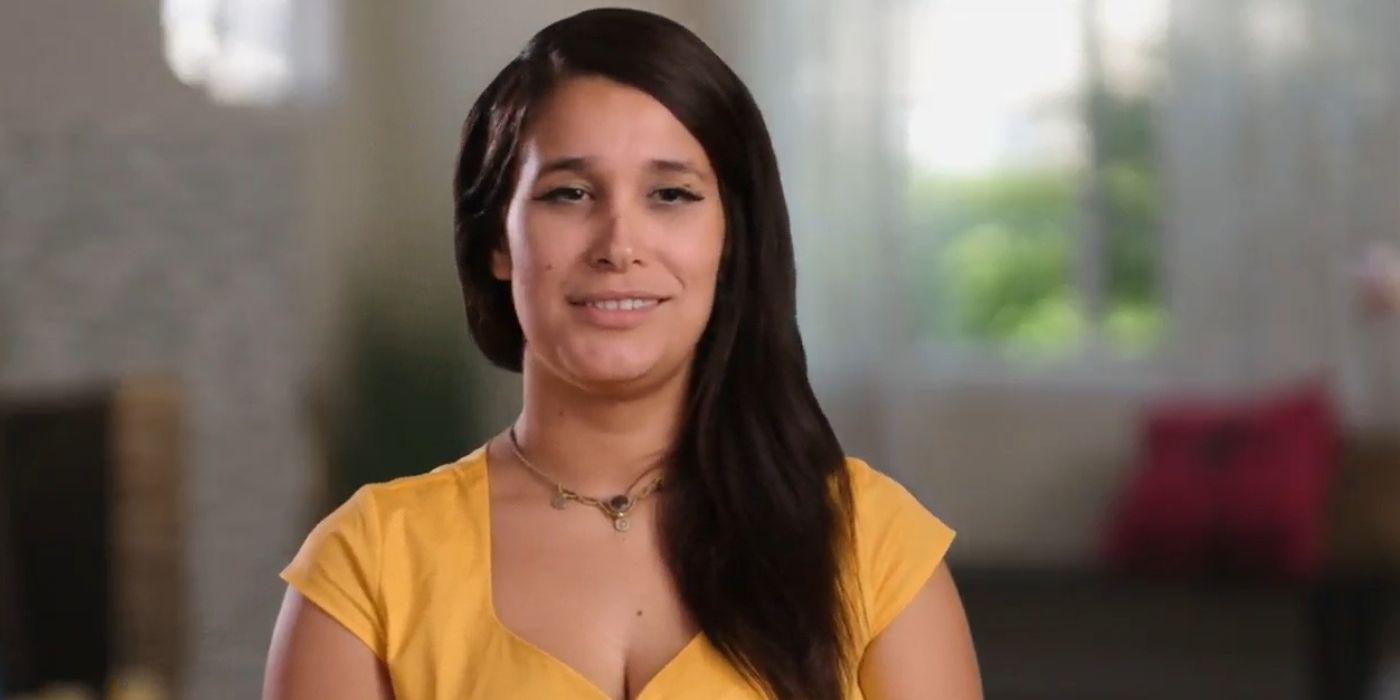 Megan In 90 Day Fiance wearing yellow top and smiling during confessional