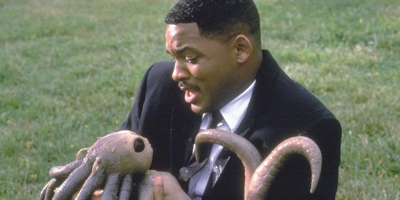 Men in Black Will Smith as Agent J holding a small tentacled alien