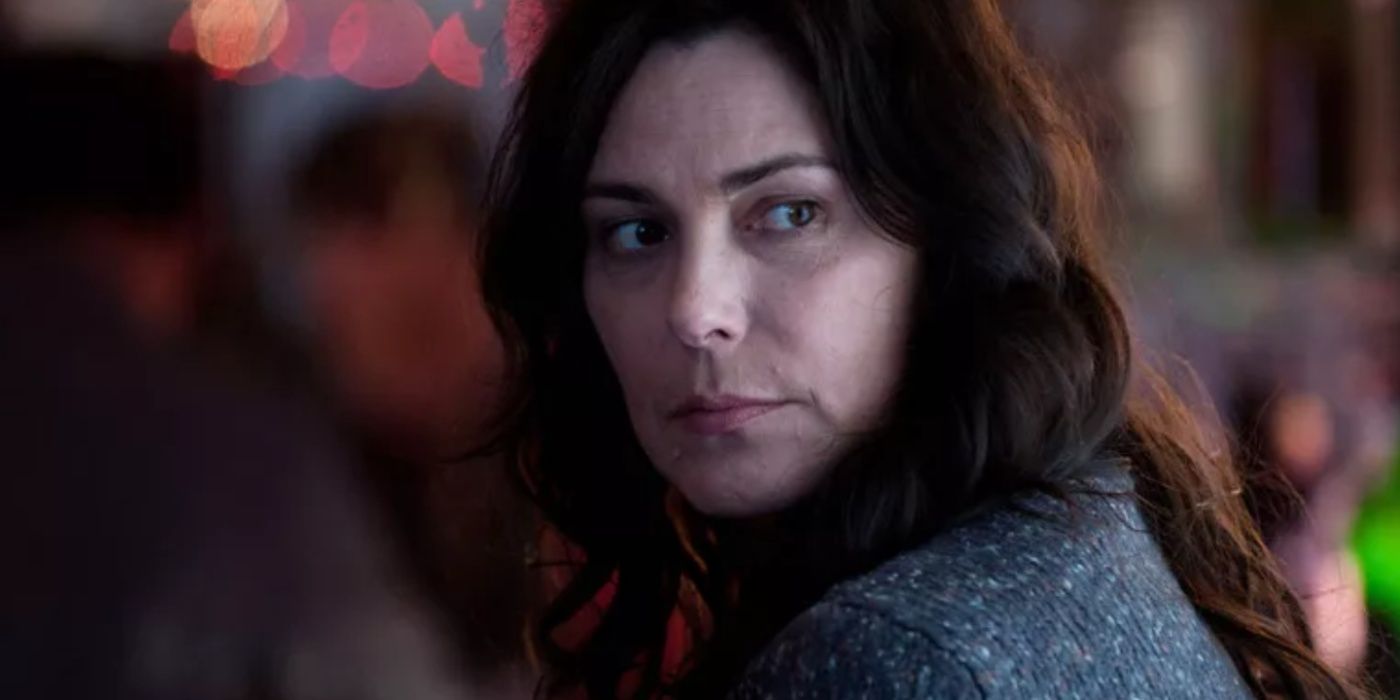 Mitch Larsen (Michelle Forbes) looking over her shoulder in The Killing