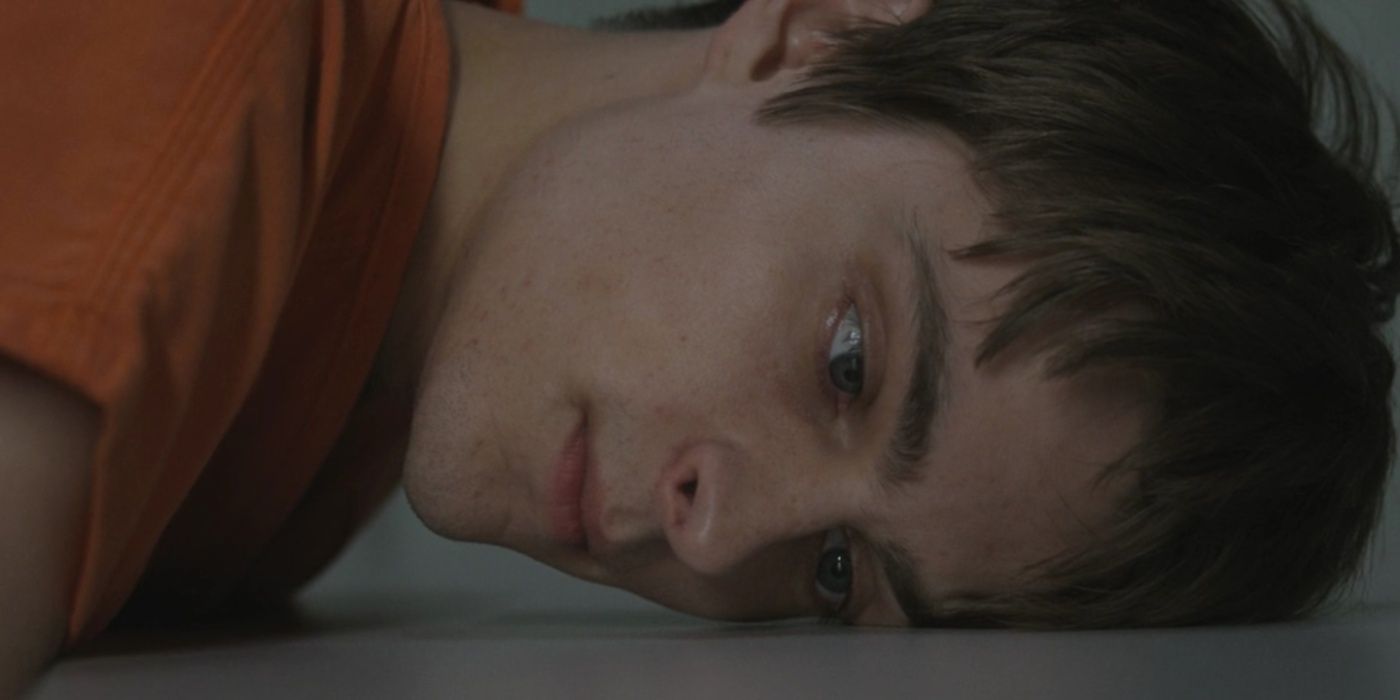 Corey Fogelmanis leaning against the floor in Criminal Minds