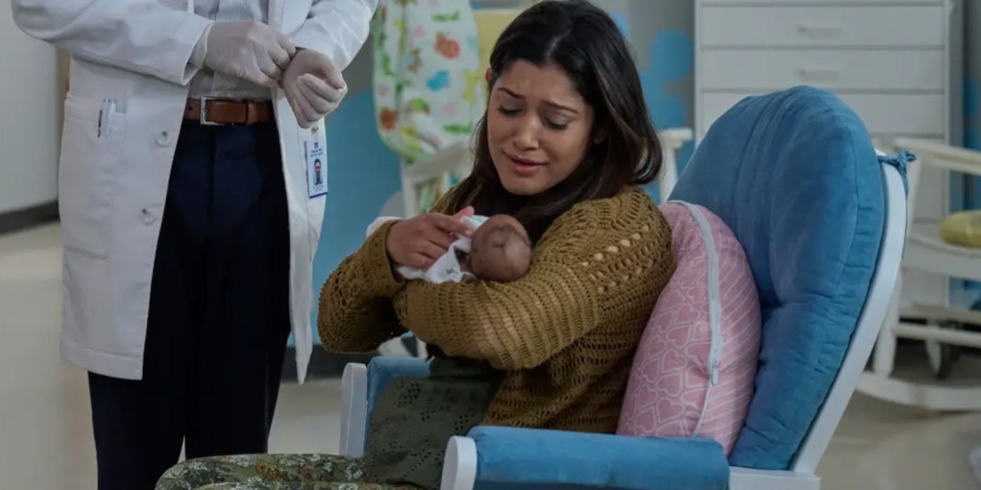 Padma (Aneesha Joshi) holding a baby in The Resident