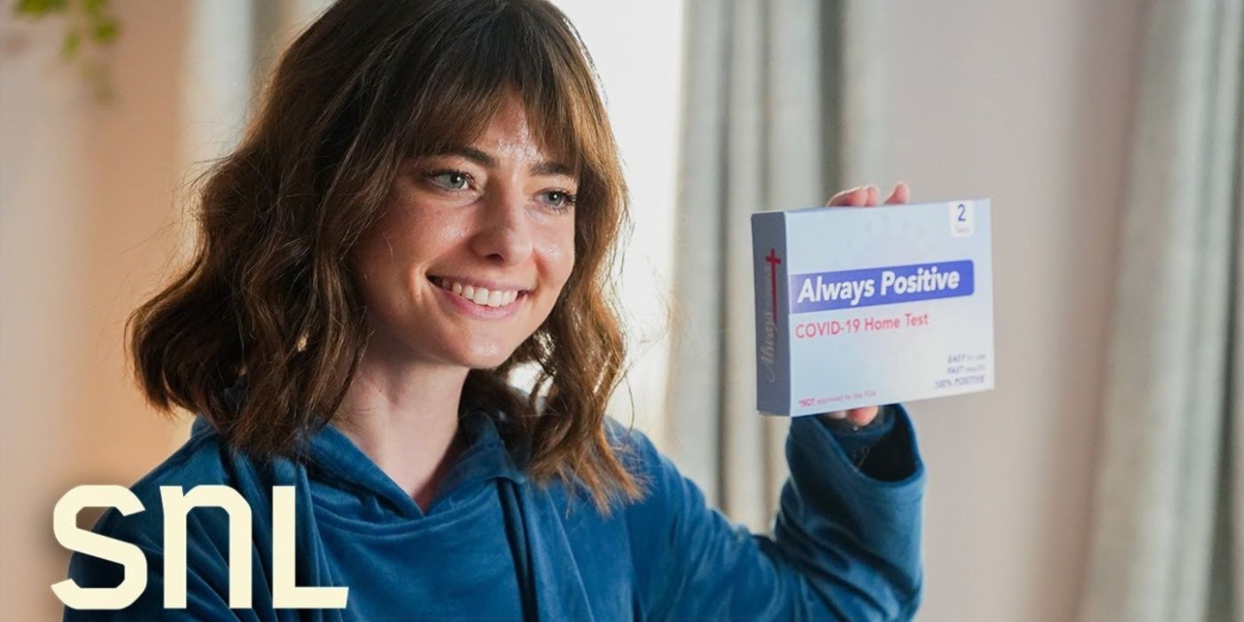 A woman holding up a positive COVID test on Saturday Night Live