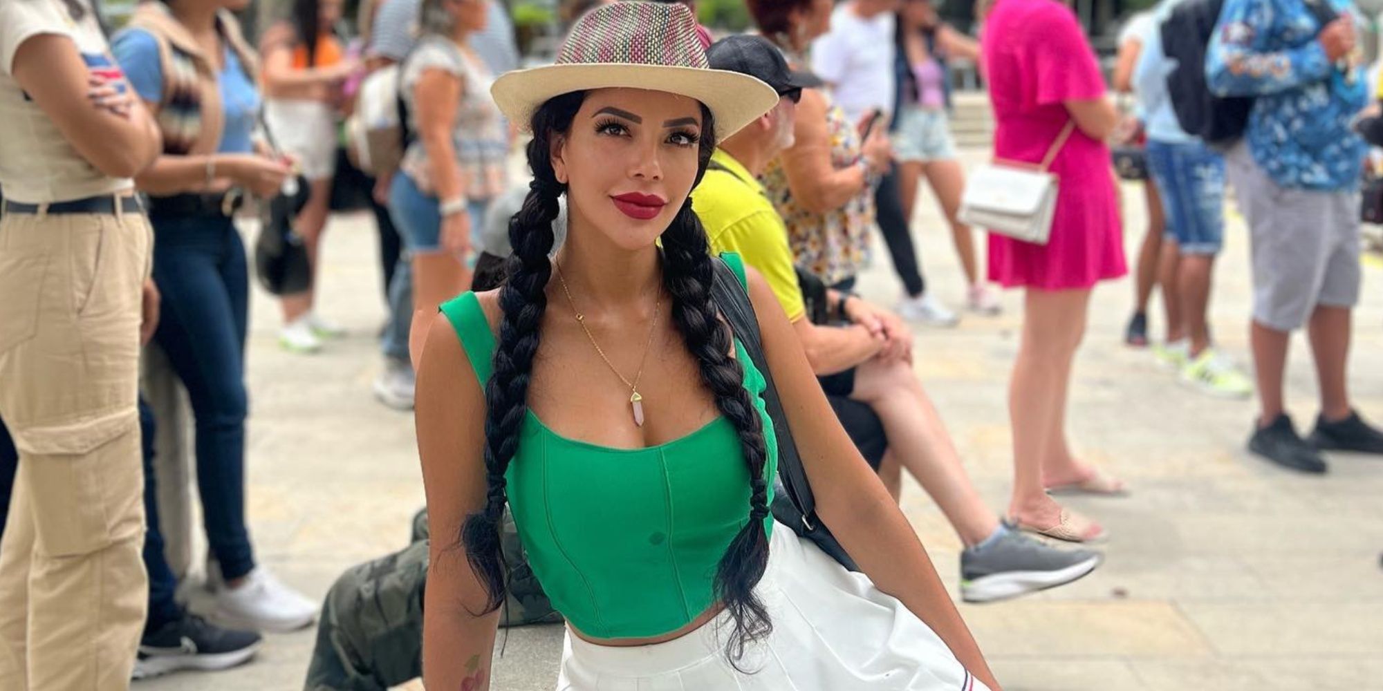 90 Day Fiancé star Jasmine Pineda wearing hat with green top and white pants on picnic