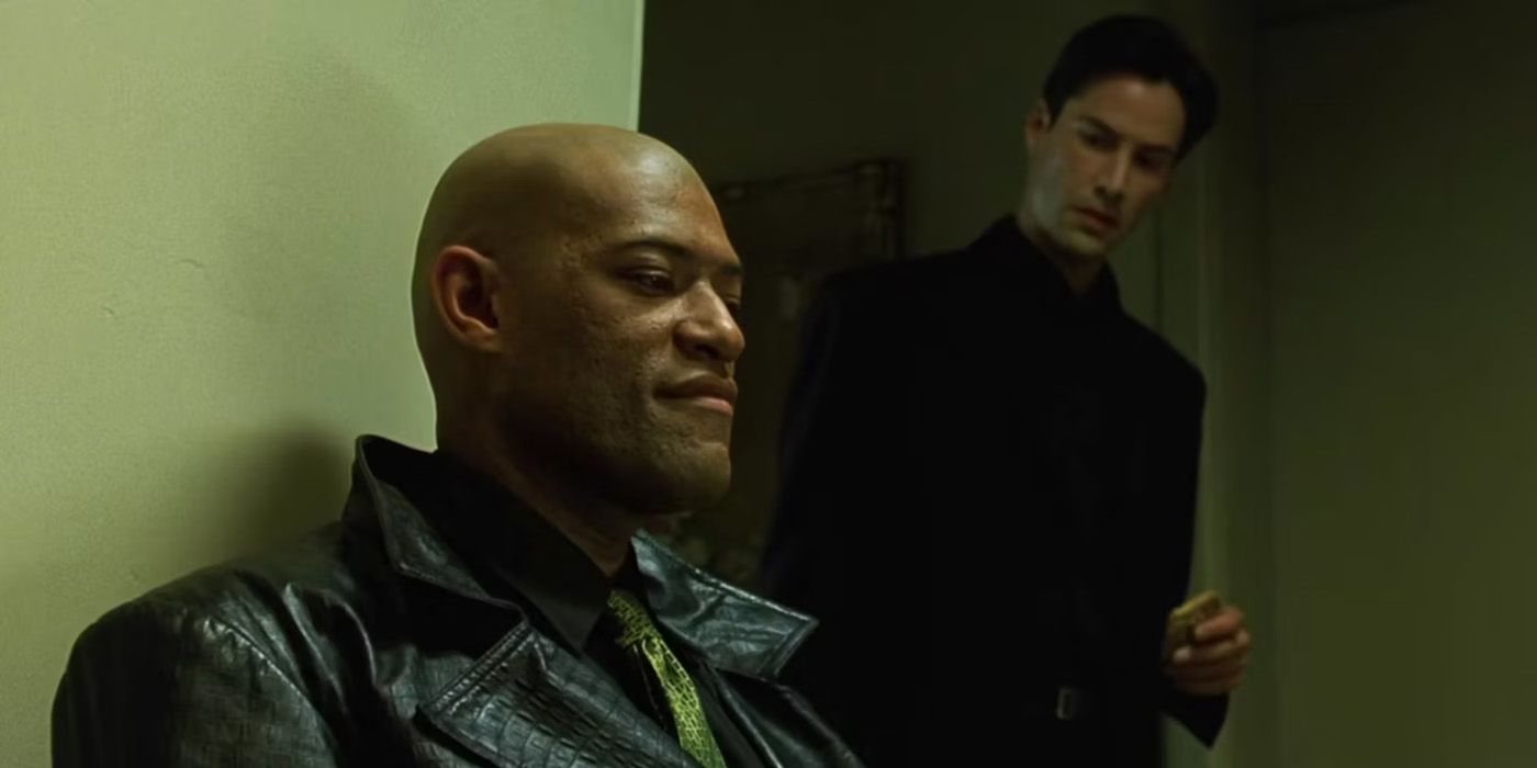 Morpheus sitting and talking to Neo in The Matrix