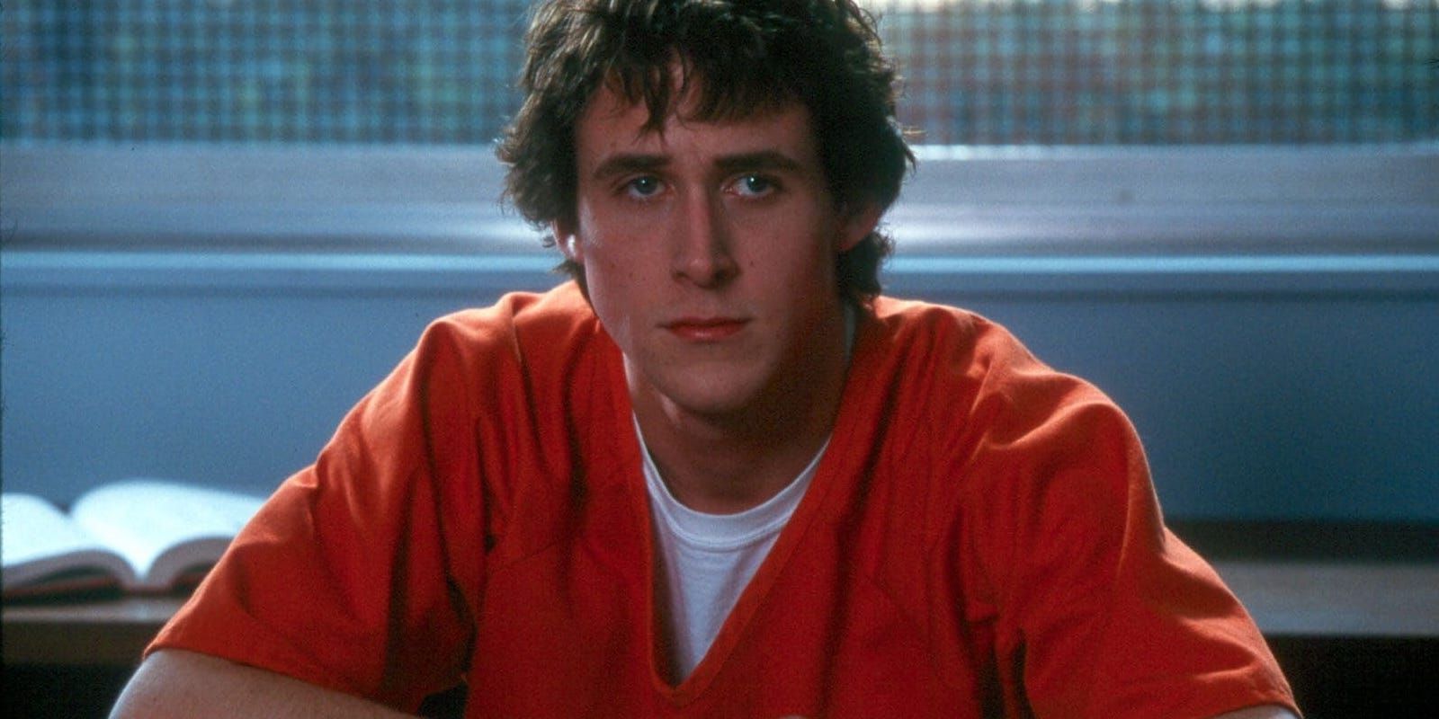 Leland P. Fitzgerald (Ryan Gosling) wearing an orange prison uniform in The United States of Leland.
