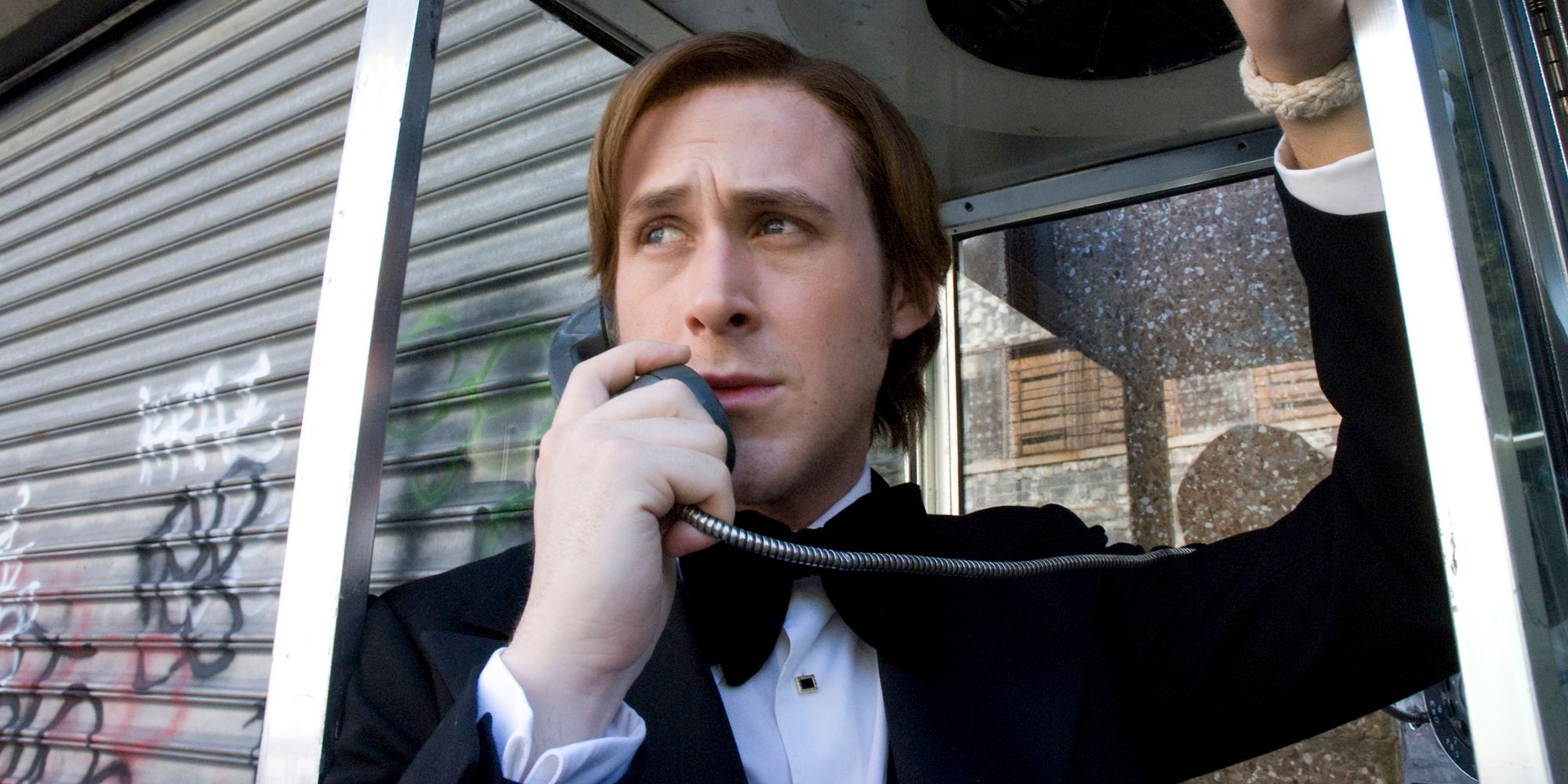 David Marks (Ryan Gosling) wearing a tuxedo and talking on a payphone in All Good Things.