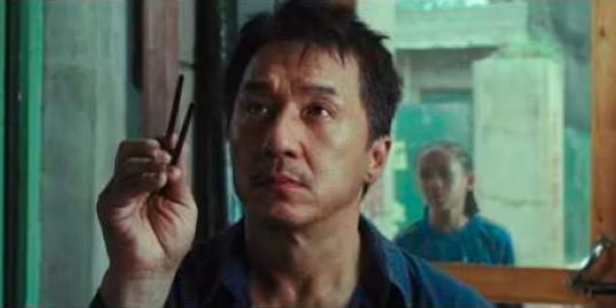Jackie Chan as Mr. Han with a pair of chopsticks in The Karate Kid 2010 remake