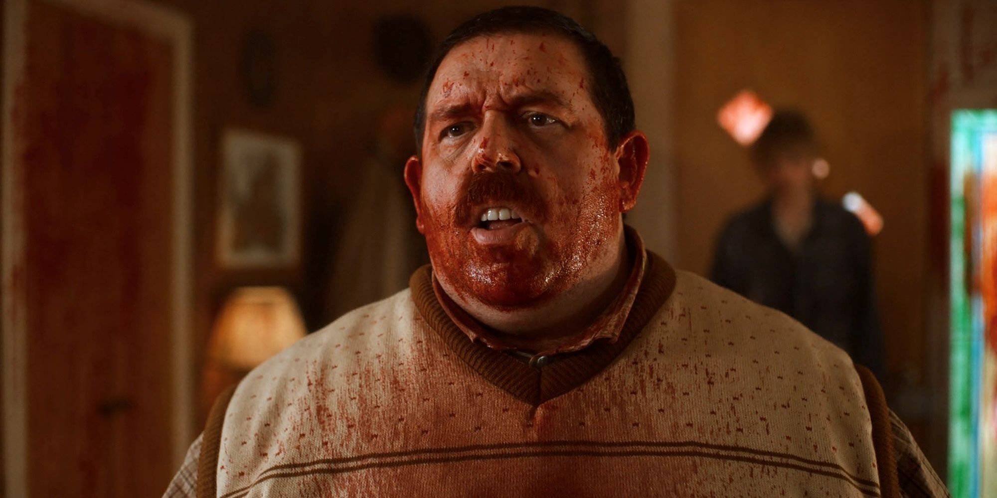 Nick Frost stands with blood on his face in Krazy House
