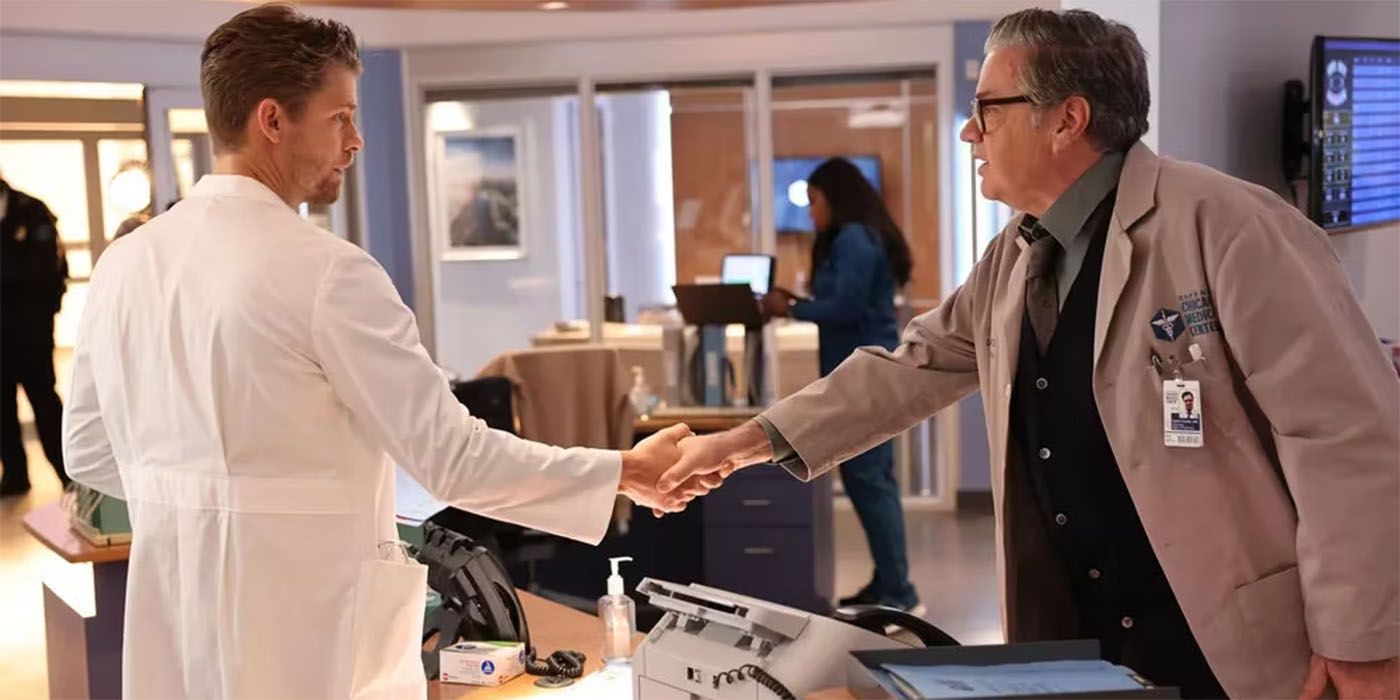 Oliver Platt as Dr. Daniel Charles shaking hands with Luke Mitchell as Dr. Mitch Ripley in Chicago Med Season 9