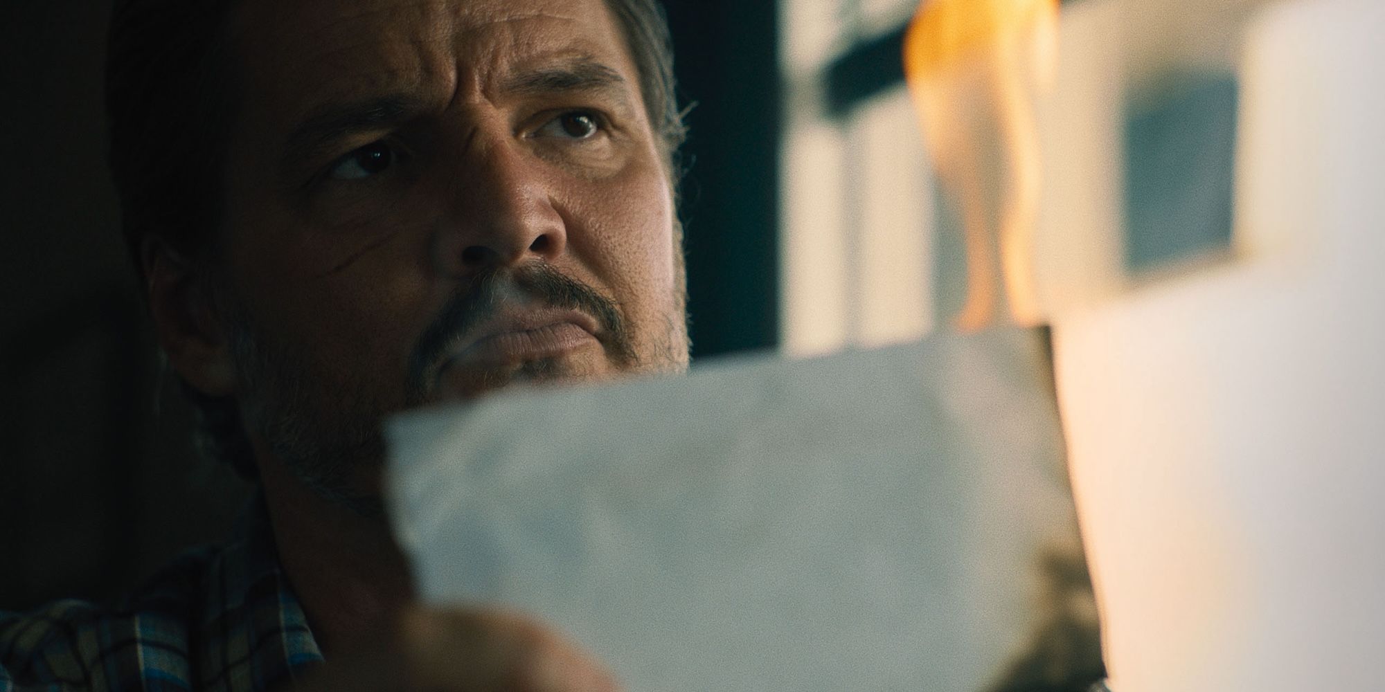 Pedro Pascal burns an envelope in a diner in Freaky Tales
