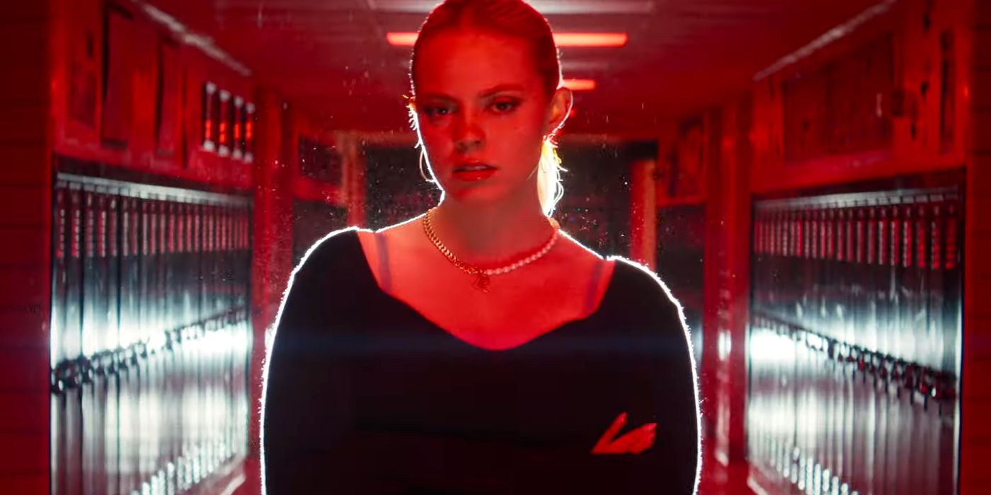 Renee Rapp as Regina George Under a Red Light in the Hallway in Mean Girls 2024