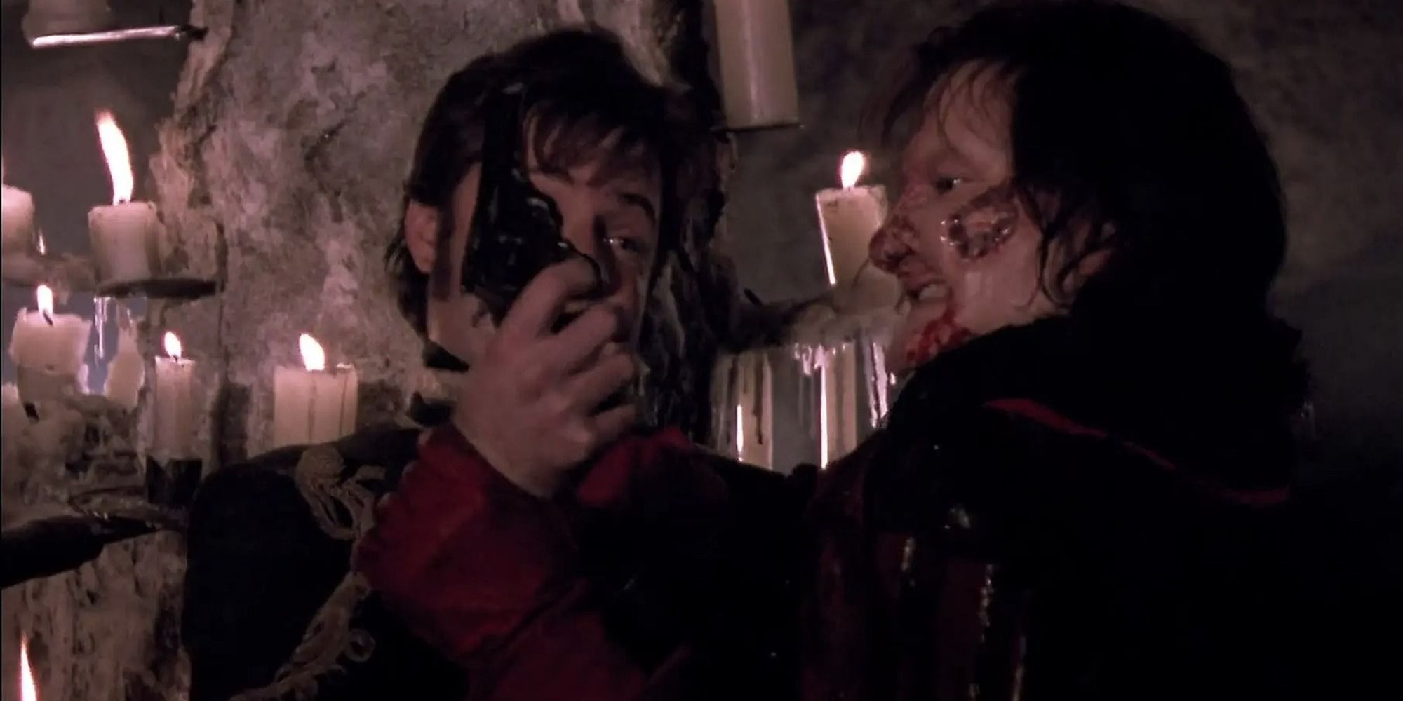 Richard and the Phantom fight over the gun in 1989's Phantom of the Opera