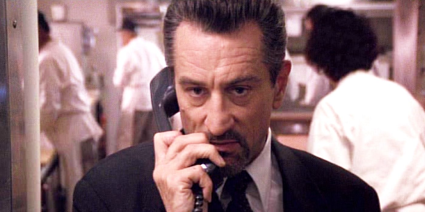 Robert De Niro ao telefone como Neil McCauley em Heat