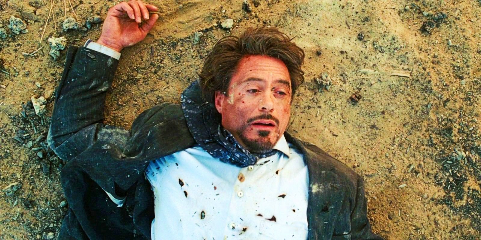 Robert Downey Jr As Tony Stark Laying On The Ground Covered In Shrapnel In Iron Man 2008